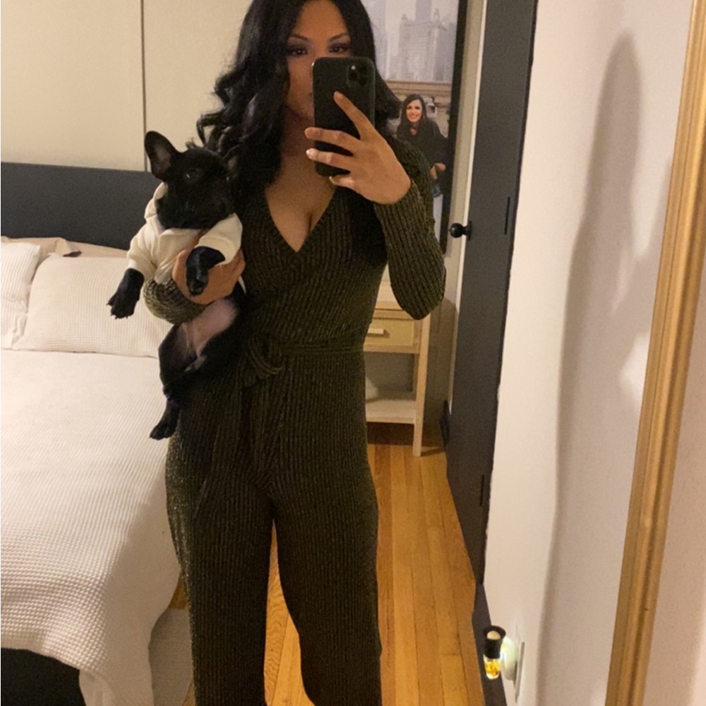 Gold and black jumpsuit. Super cute! Feels mesh but is not see through. So comfy